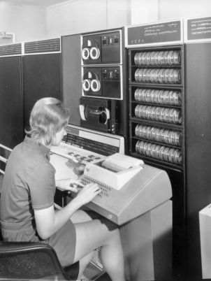 A staff member using the PDP 10 computer